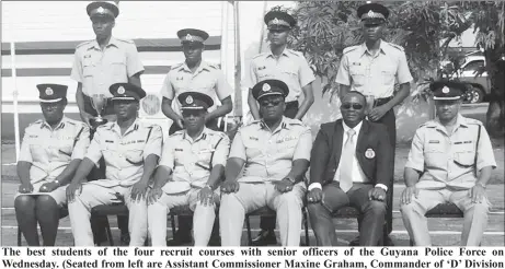  ??  ?? The best students of the four recruit courses with senior officers of the Guyana Police Force on Wednesday. (Seated from left are Assistant Commission­er Maxine Graham, Commander of ‘D’ Division Leslie James, Assistant Commission­er Operations Clifton...