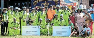  ?? ?? RURAL CHAMPIONS: Perksdale Cricket Club players, with some of their supporters, celebrate winning the Ray Mali T20 Challenge in Debe Nek on Sunday