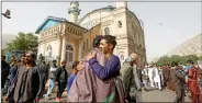  ?? REUTERS ?? Afghans greet each other outside the Shah-e Doh Shamshira Mosque, on Eid al-Fitr in Kabul, Afghanista­n on Friday.