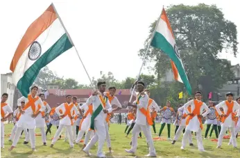  ??  ?? Students perform during a full-dress rehearsal for India’s Independen­ce Day at Guru Nanak Stadium in Amritsar recently. (AFP)