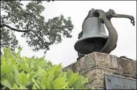  ?? DAVID.BARNES@AJC.COM) DAVID BARNES / ?? A historic bell stands on display on the United Methodist Children’s Home property, which Decatur recently purchased.