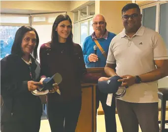  ?? ?? Runners-up were Priscilla Petersen (left) and Nathaniel Reddy (right). Between them is Léta of the George Golf Club and at the back the Safma vice-chairman, Johan Burger.
