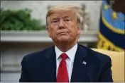  ?? EVAN VUCCI — THE ASSOCIATED PRESS ?? President Donald Trump listens to a question during a meeting with Ecuadorian President Lenin Moreno in the Oval Office of the White House on Wednesday in Washington.