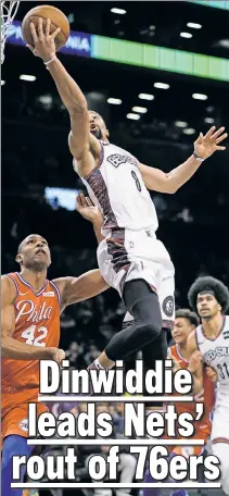  ?? Paul J. Bereswill ?? DRIVING FORCE: Spencer Dinwiddie, who finished with 24 points, drives to the basket against Al Horford during the Nets’ 109-89 win over the Sixers.