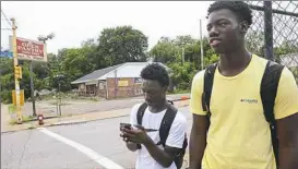  ?? Lake Fong/Post-Gazette ?? Charles Powell, left, 14, a sophomore at Barack Obama Academy, and Willie Knight, 16, a junior at Westinghou­se High School, use a geographic informatio­n system to track informatio­n to see how the environmen­t influences lead exposure.