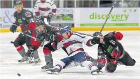  ??  ?? Comets’ Scott Marr battles his way through (see story right).