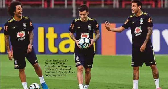  ?? AFP PIC ?? (From left) Brazil’s Marcelo, Philippe Coutinho and Neymar train at the Morumbi Stadium in Sao Paulo on Saturday.