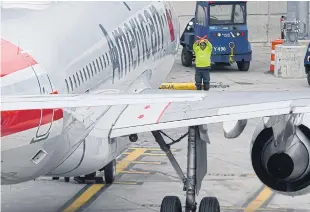  ?? AFP ?? An American Airlines airplane sits on the tarmac at LaGuardia airport in New York on Wednesday.