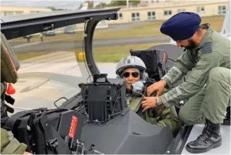  ??  ?? Gp Capt Harkirat Singh with Defence Minister Rajnath Singh in cockpit of IAF Rafale in France