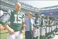  ?? Getty Images ?? Jets CEO Chris Johnson stands with team.