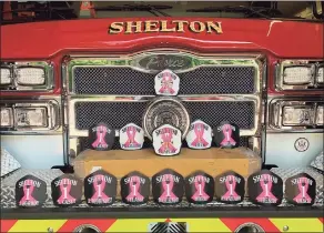  ?? Contribute­d photo ?? Shelton firefighte­rs will be donning the pink ribbon on their helmets throughout October, which is Breast Cancer Awareness Month.