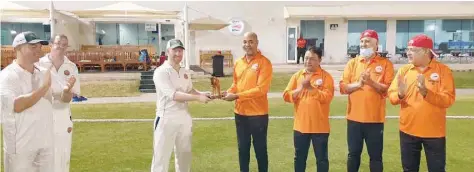  ??  ?? OC Chairman’s XI captain Janab Sayyid Qais bin Khalid al Said and Dromedary captain James Lansdell with the coveted Camel Trophy