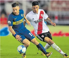  ?? M. CARROLL ?? El último. Nandez y Enzo Pérez, en el 2-1 de Boca en Núñez.