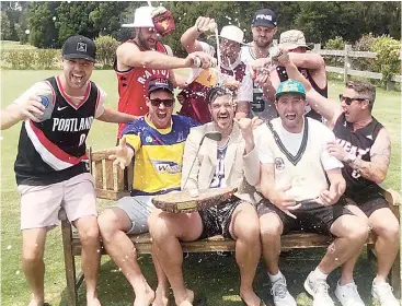  ??  ?? Thomas celebrates with his mates after their annual golf day at Inverloch together.Dale continues to remain a member at the Drouin Golf Club and often enjoys a round when he’s back in town.