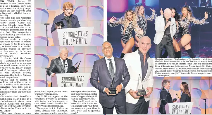  ??  ?? (Clockwise from above) Pitbull performs at The Songwriter­s Hall of Fame 48th Induction and Awards Gala at the New York Marriott Marquis Hotel in Manhattan, New York, on Thursday. Pitbull (inset left) receives the Global Ambassador Award at the gala;...