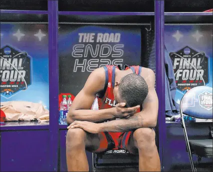  ?? David J. Phillip The Associated Press ?? Florida Atlantic guard Johnell Davis has his head down in a stunned locker room after Saturday’s loss to San Diego State. Davis missed a layup with nine seconds left that would have padded the lead.