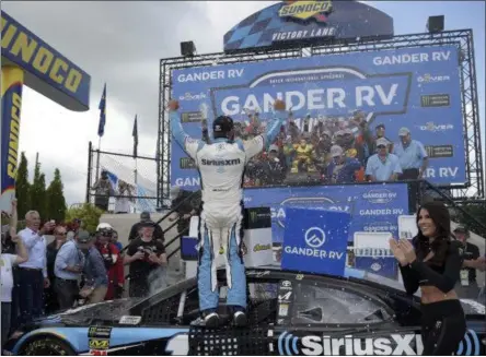  ?? WILL NEWTON - THE ASSOCIATED PRESS ?? Driver Martin Truex Jr. (19) celebrates with his team after winning the NASCAR Cup Series auto race, Monday, May 6, 2019, at Dover Internatio­nal Speedway in Dover, Del.