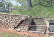  ?? Doug Walker ?? A portion of the new retaining wall at Myrtle Hill was breached by storm water runoff Thursday night. The same section of wall had a much more serious collapse in march two years ago.