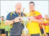  ?? PHOTO / GETTY IMAGES. ?? Thames Valley head coach Matt Bartleet and captain Brett Ranga celebrate with the Meads Cup after beating South Canterbury.