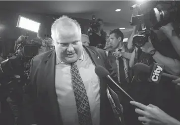  ?? CHRIS YOUNG/THE CANADIAN PRESS ?? Rob Ford returns from council in Toronto on Friday. He displays the same condescend­ing populism, the same aggressive­ly dumb, harshly divisive message that has become the playbook for the right generally in this country, Andrew Coyne says.