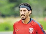  ?? [MATT ROURKE/ THE ASSOCIATED PRESS] ?? United States’ Omar Gonzalez moves across the field to speak with members of the media Tuesday at the University of Pennsylvan­ia in Philadelph­ia.