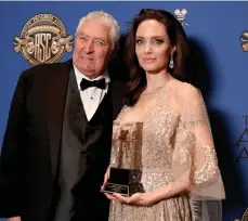  ??  ?? Angelina Jolie gets the Board of Governors award from Dean Semler