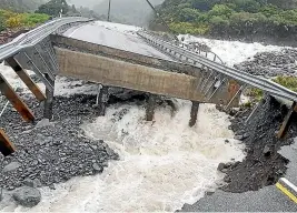  ??  ?? Above: Heavy rain has caused slips and damaged parts of State Highway 73 between Arthur’s Pass and the West Coast. The western approach of Goat Creek Bridge has been washed away.