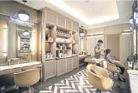  ?? ?? The salon is divided into two zones for hair and nail spa services.