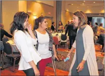  ?? ROSIE MULLALEY/THE TELEGRAM ?? Candace Carnahan (right) of New Brunswick speaks to fellow amputee Sydney Learning (centre) of Cartwright and Cathy Ryan of the Murphy Centre Monday afternoon following the St. John’s Board of Trade luncheon at the Holiday Inn, where Carnahan was the...