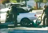  ?? COURTESY OF JOSH GIL ?? A still from video shows a San Jose police officer drag a woman in a McDonald’s parking lot.