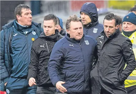  ??  ?? Neil McCann and Tommy Wright exchange words at the end of the last Tayside derby at Dens Park.