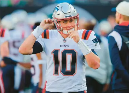  ?? NOAH K. MURRAY/AP ?? Patriots quarterbac­k Mac Jones (10) looks on during the second half of an Oct. 30 game against the New York Jets in East Rutherford, N.J.