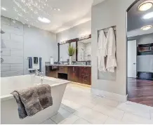  ??  ?? The Ultimate Renovation­s show home was gutted to lift the ceilings and give the place a more contempora­ry feel, including in the bathrooms.