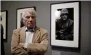  ??  ?? Don McCullin in 2019, next to his 1968 photograph of a US marine in Vietnam. Photograph: Matt Dunham/AP