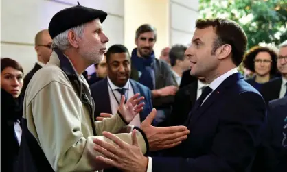  ?? Photograph: Reuters ?? French mathematic­s teacher Pierre Coste speaking with President Emmanuel Macron about pensions.