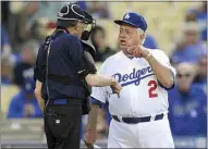  ?? KEITH BIRMINGHAM / THE ORANGE COUNTY REGISTER VIA AP ?? Former Los Angeles Dodgers manger Tommy Lasorda argues with home plate umpire Larry King during the Old-Timers game prior to a baseball game between the Atlanta Braves and the Los Angeles Dodgers on June 8, 2013, in Los Angeles.