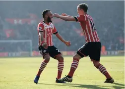  ??  ?? OH YEAH! James Ward-Prowse celebrates with Nathan Redmond during Southampto­n’s win over champions Leicester City yesterday.