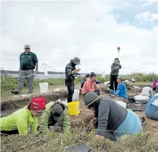  ?? PARKS CANADA HANDOUT/THE CANADIAN PRESS ?? Students and researcher­s are seen during a dig at the Fortress of Louisbourg National Historic Site in this undated handout photo. Up to 1,100 residents of the French fort are buried on the site, which must be excavated because it is threatened by...