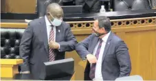  ?? African News Agency (ANA) ?? DA interim leader John Steenhuise­n greets President Cyril Ramaphosa at the start of the special Parliament­ary sitting session where the president unveiled an economic recovery plan for South Africa. | IAN LANDSBERG