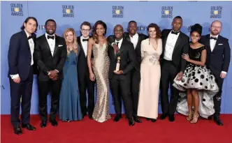  ?? — AP/AFP photos ?? (From left) The cast and crew of "Moonlight," winners of Best Motion Picture - Drama, pose in the press room during the 74th Annual Golden Globe Awards at The Beverly Hilton Hotel.
