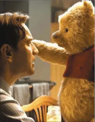  ??  ?? Ewan McGregor with Pooh Bear in Christophe­rRobin.