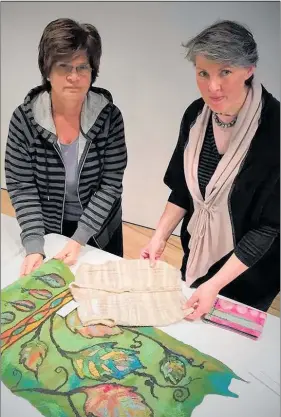  ??  ?? Fibreworks 2018 guest selectors Vanessa Bolton and Tracy White inspect entries.