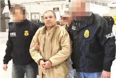  ??  ?? File photo shows El Chapo (centre) escorted in Ciudad Juarez by the Mexican police as he was extradited to the United States. — AFP photo