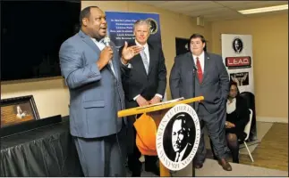  ?? The Sentinel Record/Richard Rasmussen ?? PAVING THE FUTURE: DuShun Scarbrough, left, executive director of the Arkansas Martin Luther King Jr. Commission, speaks during a computer science summit at the Webb Community Center on Tuesday as Hot Springs Mayor Pat McCabe, center, and Ben Gilmore,...