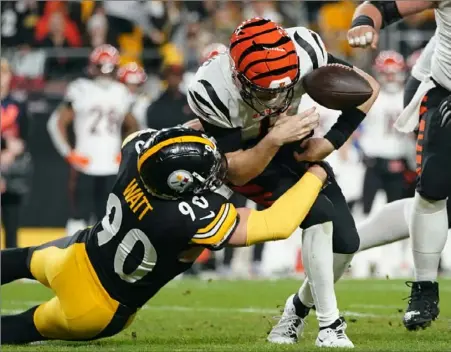  ?? Sebastian Foltz/Post-Gazette ?? T.J. Watt knocks the ballm loose while sacking Bengals quarterbac­k Jake Browning.