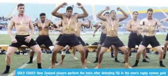  ??  ?? GOLD COAST: New Zealand players perform the haka after defeating Fiji in the men’s rugby sevens gold medal match at the Robina Stadium during the 2018 Gold Coast Commonweal­th Games on the Gold Coast on Sunday. — AFP