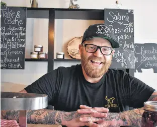  ?? MICHAEL ROBAR/THE GUARDIAN ?? Dave Mottershal­l stands behind the counter of the newly reopened Terra Rossa in Charlottet­own. The grocerant offers a selection of local produce and products as well as dine-in or takeaway service.