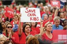  ?? JASON GETZ / AJC ?? A crowd rallies during the Moms Demand Action Advocacy Day event at Liberty Plaza on Wednesday in Atlanta. The protest came on the heels of the mass shooting at a school in Florida.