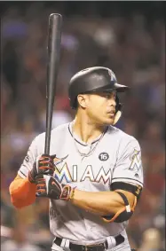  ?? Christian Petersen / Getty Images ?? Giancarlo Stanton hit 59 home runs as a member of the Marlins last season.