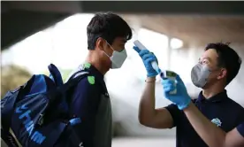  ?? Photograph: Seo Hyemin/FA Photos ?? Jeonbuk Hyundai Motors’ Lee Dong-gook has his body temperatur­e taken before the practice match against Daejeon Citizen last weekend.